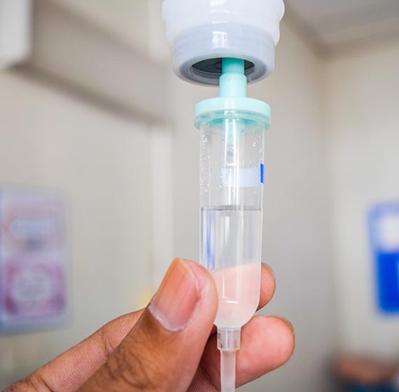 Close-up of a nurse preparing IV for patient