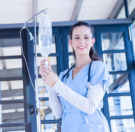Nurse getting an IV bag ready for a patient